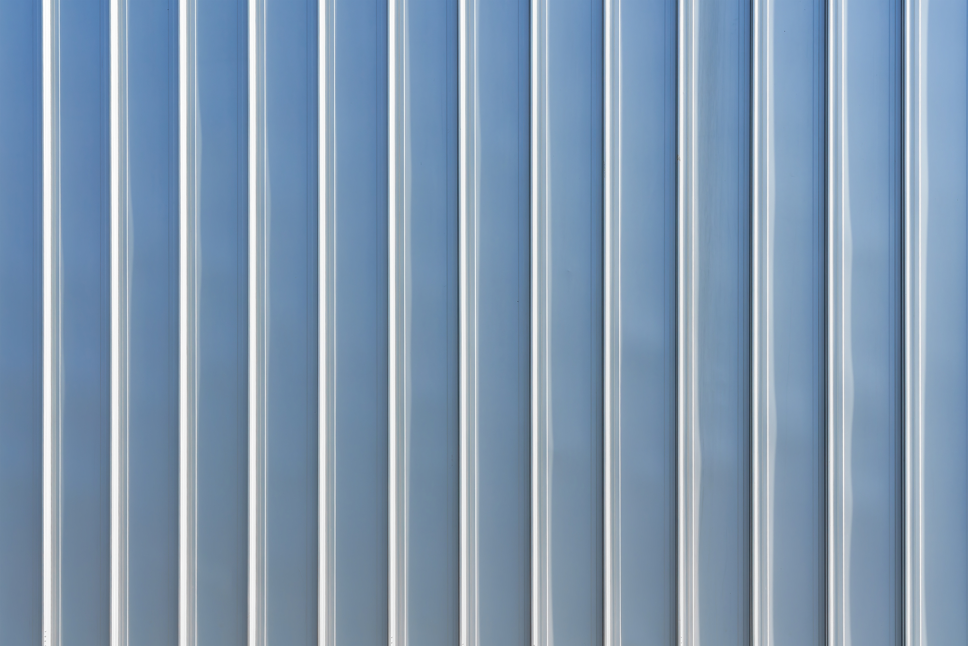 The texture of the cladding of the building from metal aluminum metal cladding